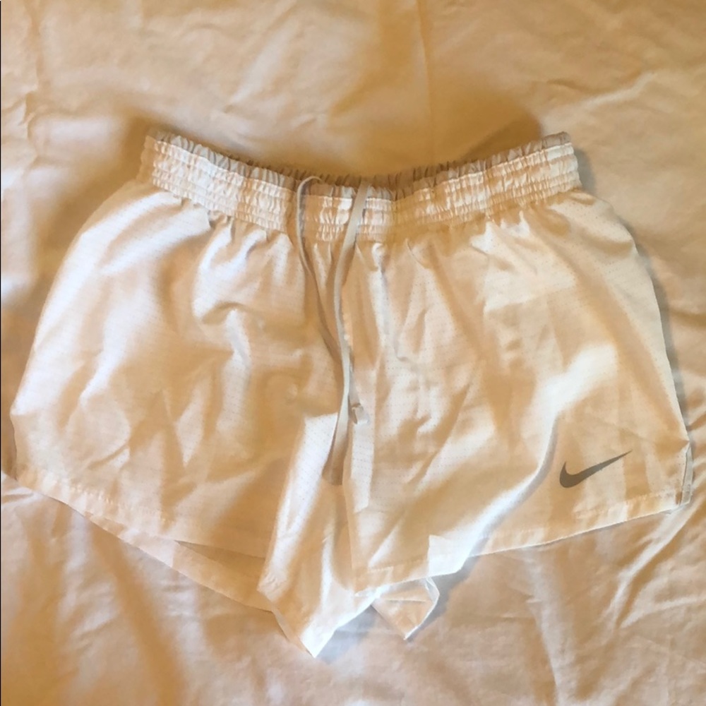 Nike women’s dri-fit shorts white with gray trim.